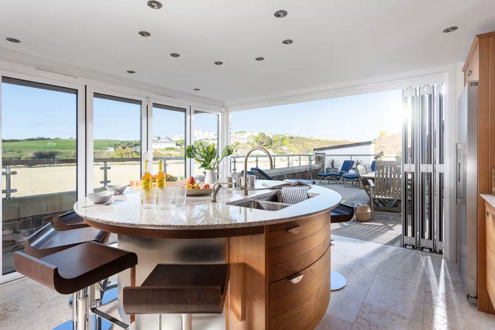 Kitchen opening to beach terrace